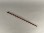 A wooden measuring stick